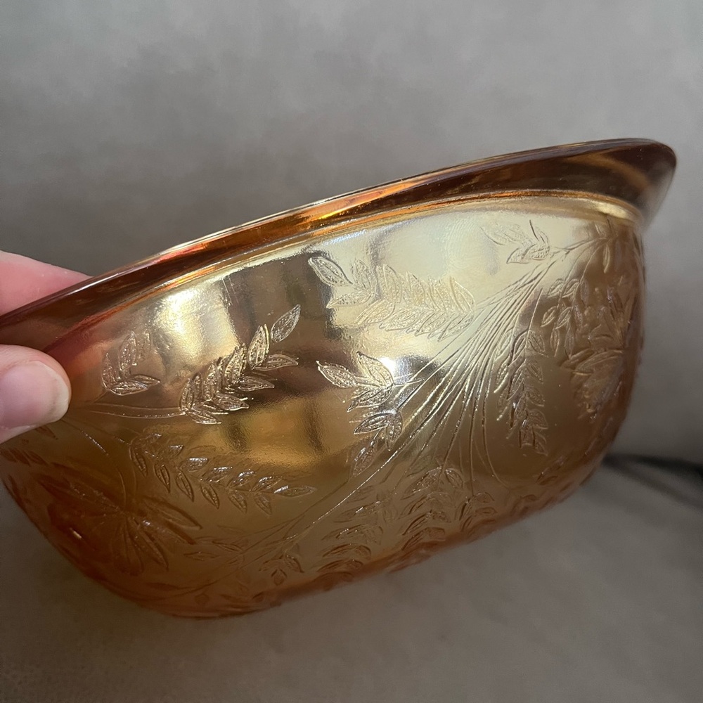 Vintage amber-colored vessel is a Floragold "Louisa" pattern glass bowl